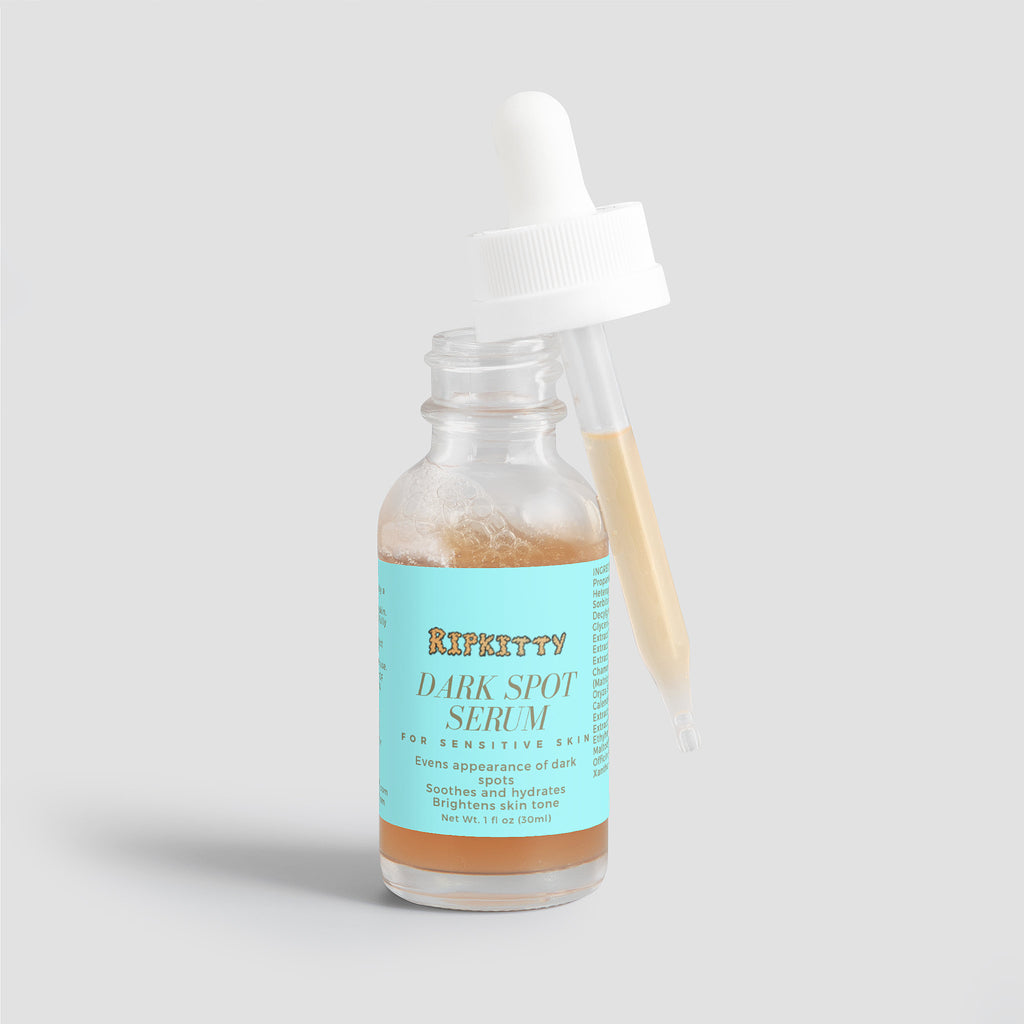 Bottle of Riptitty Dark Spot Serum on a light gray background