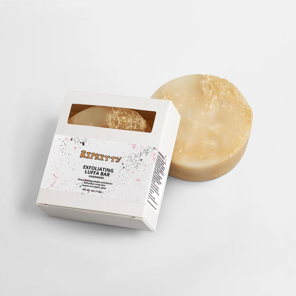 Exfoliating loofah bar with packaging on a white background