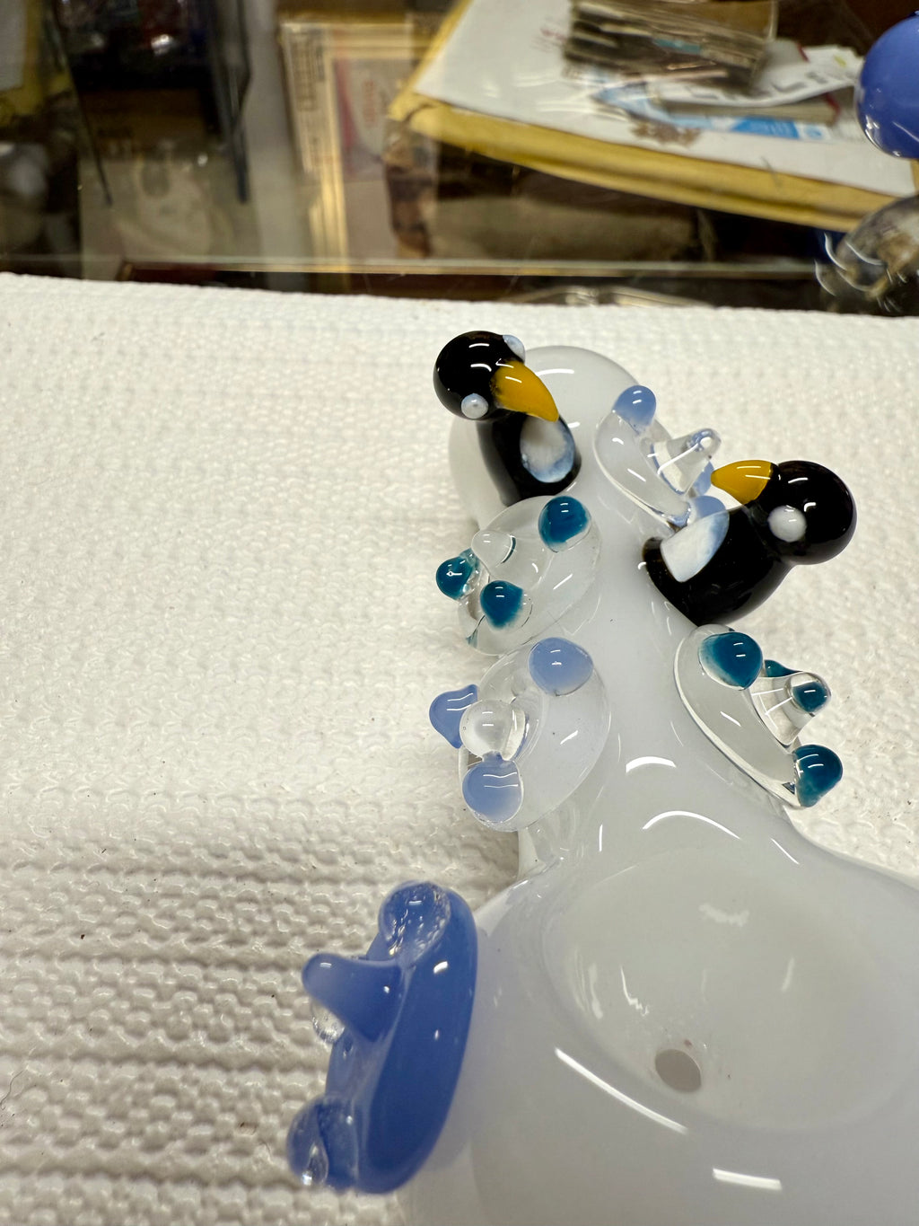 Ripkitty 4.5" penguin art pipe — side profile close-up of white body with sculpted black and white penguin accents