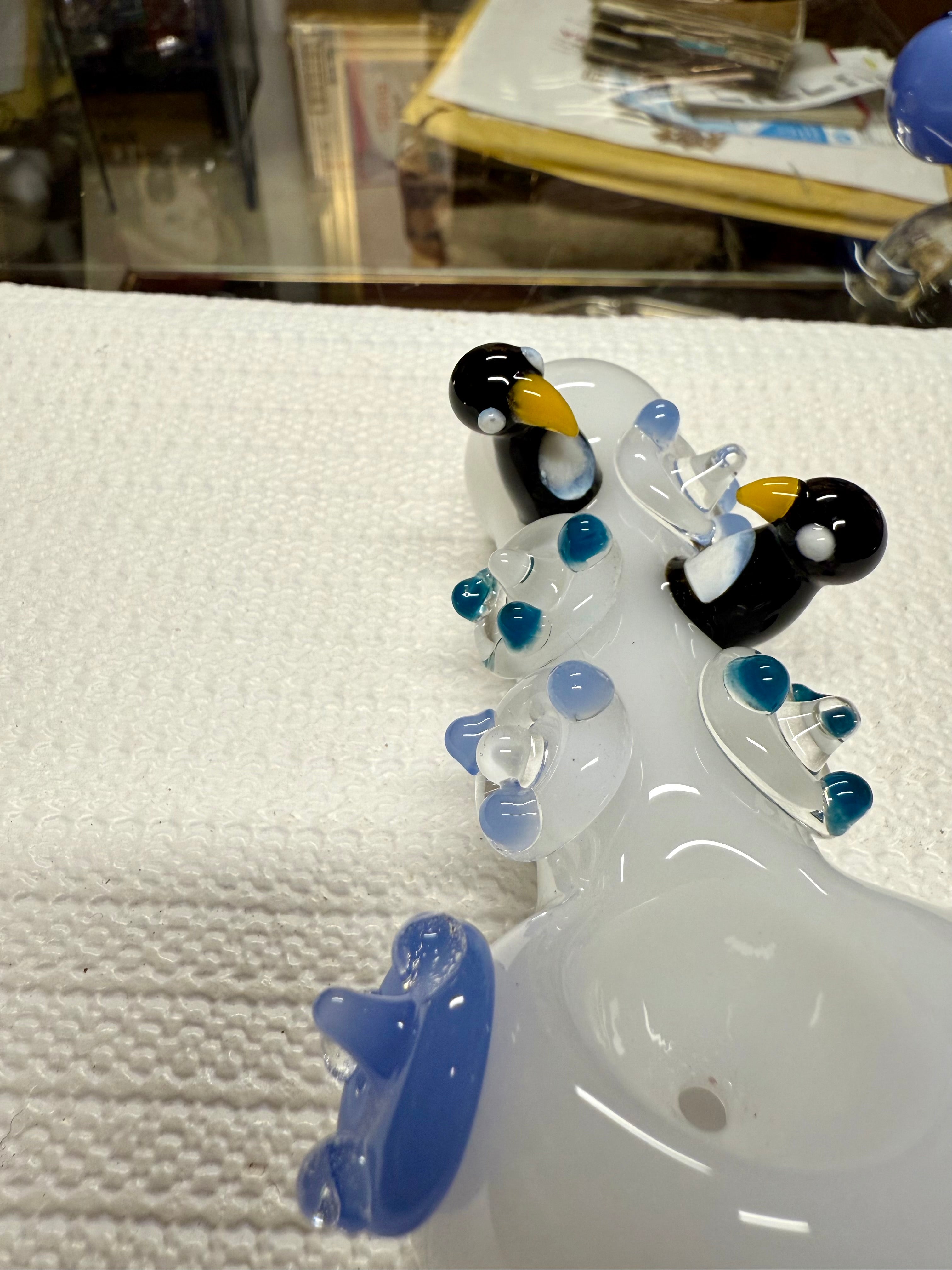 Ripkitty 4.5" penguin art pipe — side profile close-up of white body with sculpted black and white penguin accents