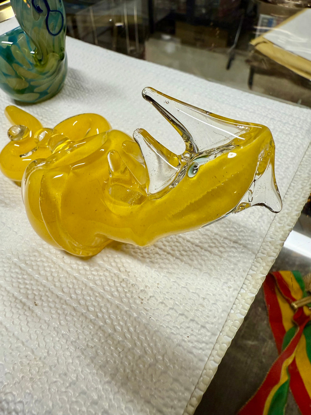 Side profile of Ripkitty 5" COBRA glass hand pipe showing full coiled snake form — borosilicate glass, yellow color