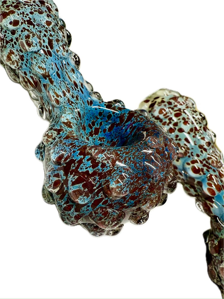 Ripkitty 5" blue spike spoon pipe — overhead angled view of bowl end showing teal-blue dominant frit with raised bubble nodule texture and open bowl chamber, white background