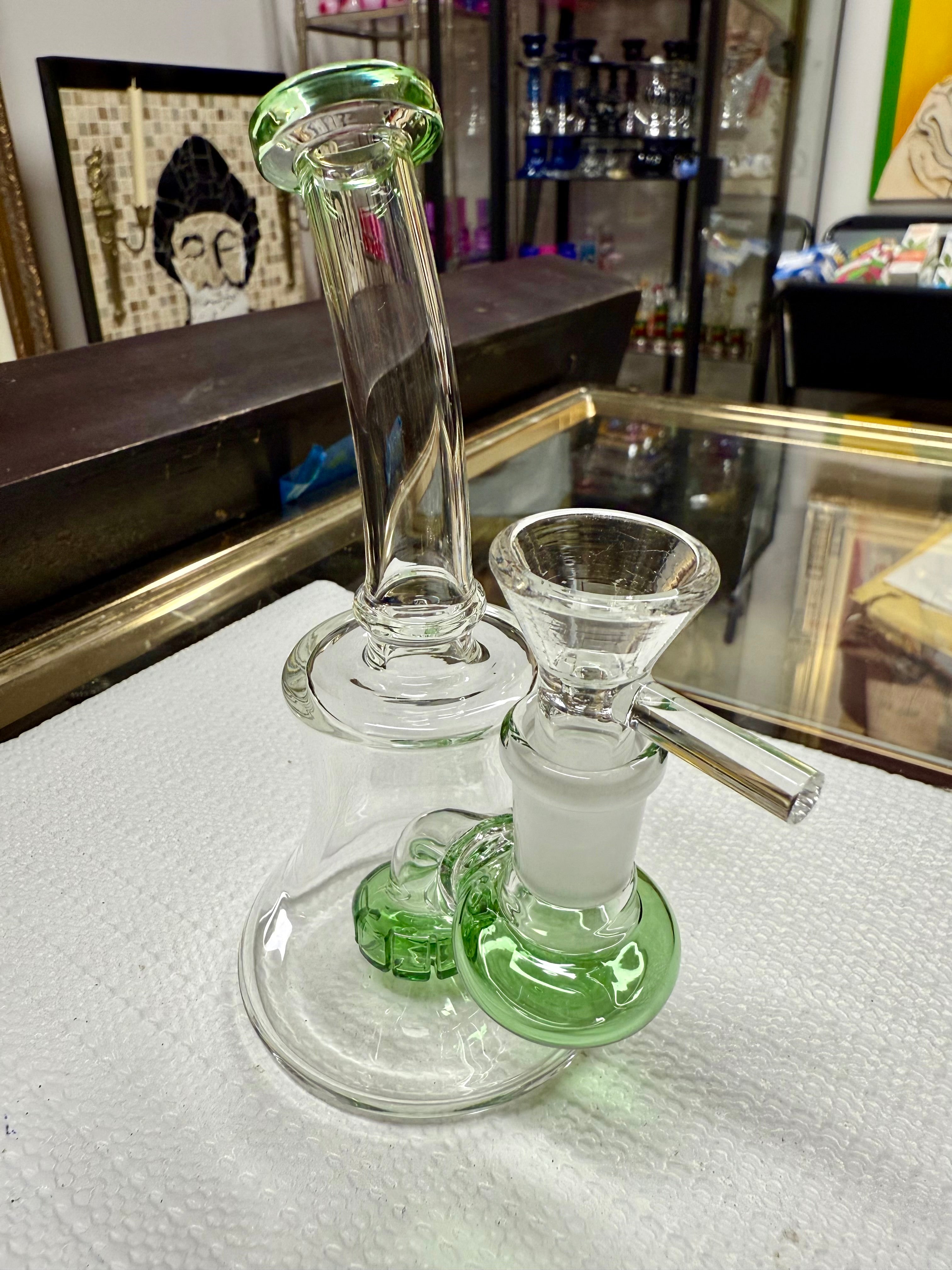 Close-up of Ripkitty 7" bong mouthpiece — flared green-tinted rim with iridescent color shower neck detail, white background