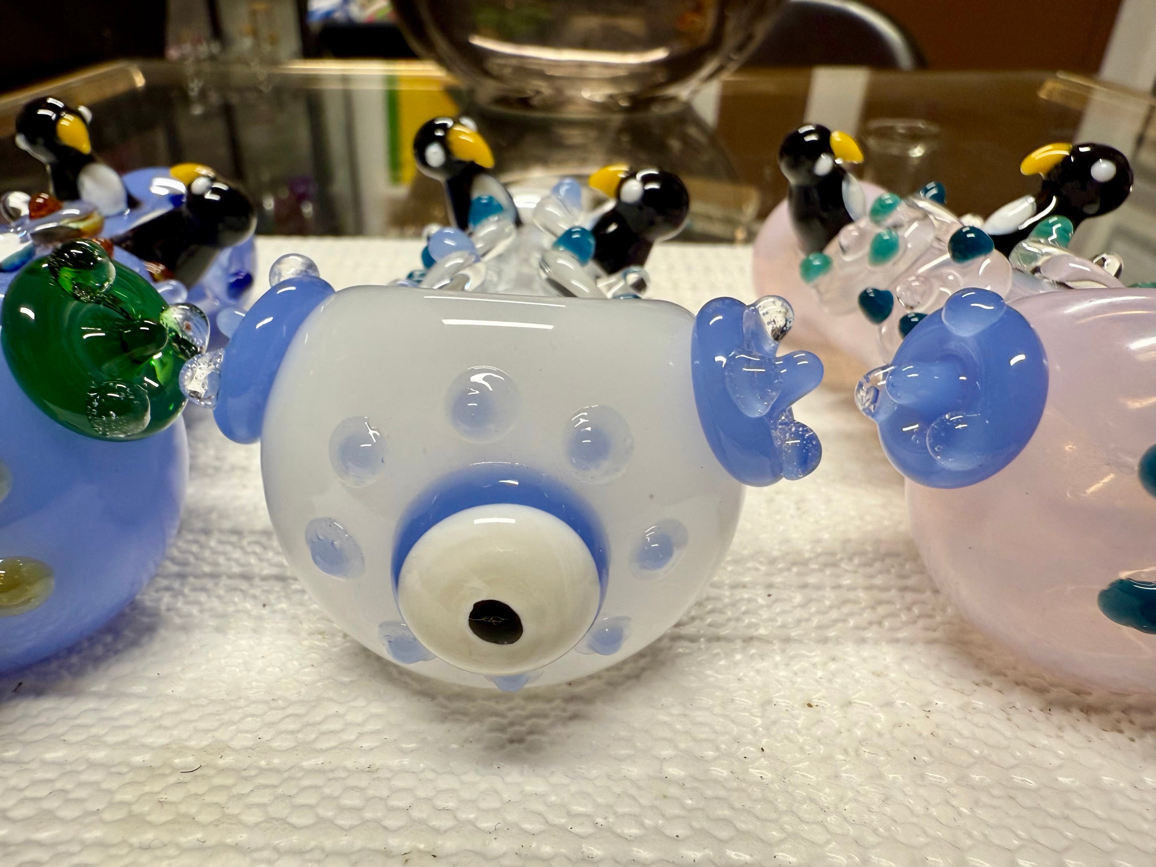 Ripkitty 4.5" penguin art pipe — side profile close-up of white body with sculpted black and white penguin accents