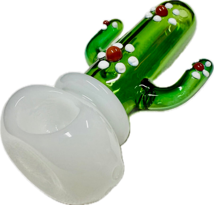 Ripkitty 4.5" cactus glass spoon pipe — low-angle view showing green saguaro cactus body with white dot nodules and red bead accents, milky white opal bowl facing forward, white background
