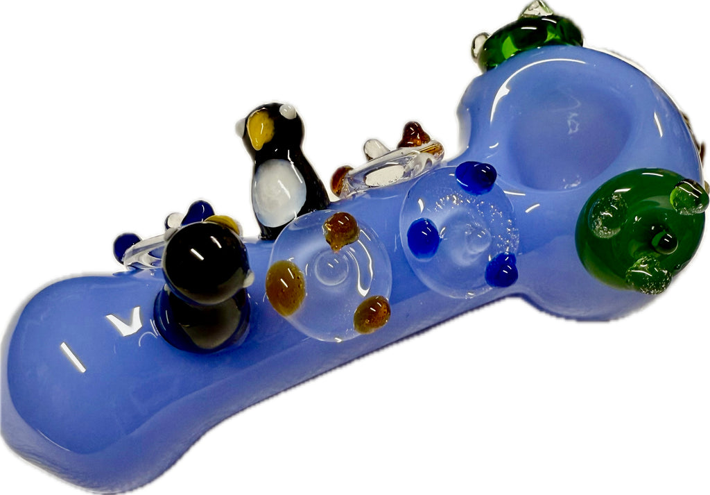Ripkitty 4.5" penguin art spoon pipe — periwinkle blue, three-quarter rear angle showing mouthpiece, penguin figures, and dot pattern