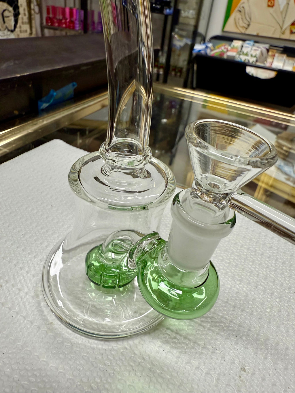 Ripkitty 7" conical bong — color shower neck, green base accent, rear angle showing bell base percolator chamber and downstem joint
