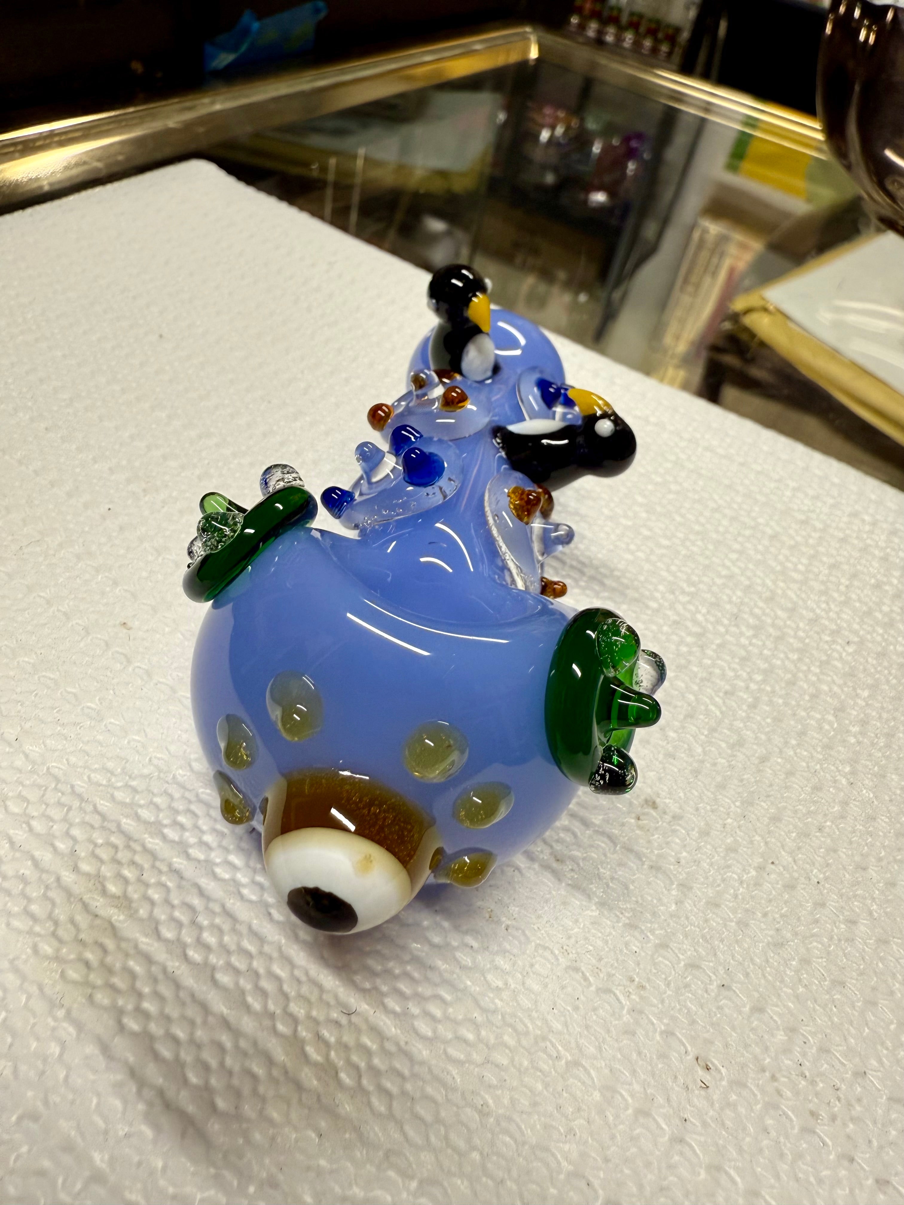 Ripkitty 4.5" penguin art glass pipe — three-quarter view of periwinkle colorway showing full penguin art series design