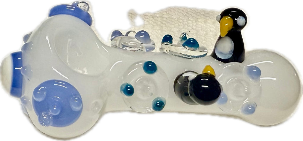 Ripkitty 4.5" penguin art spoon pipe — frosted clear colorway with blue flipper accents, side view showing penguin sculpts and dot pattern