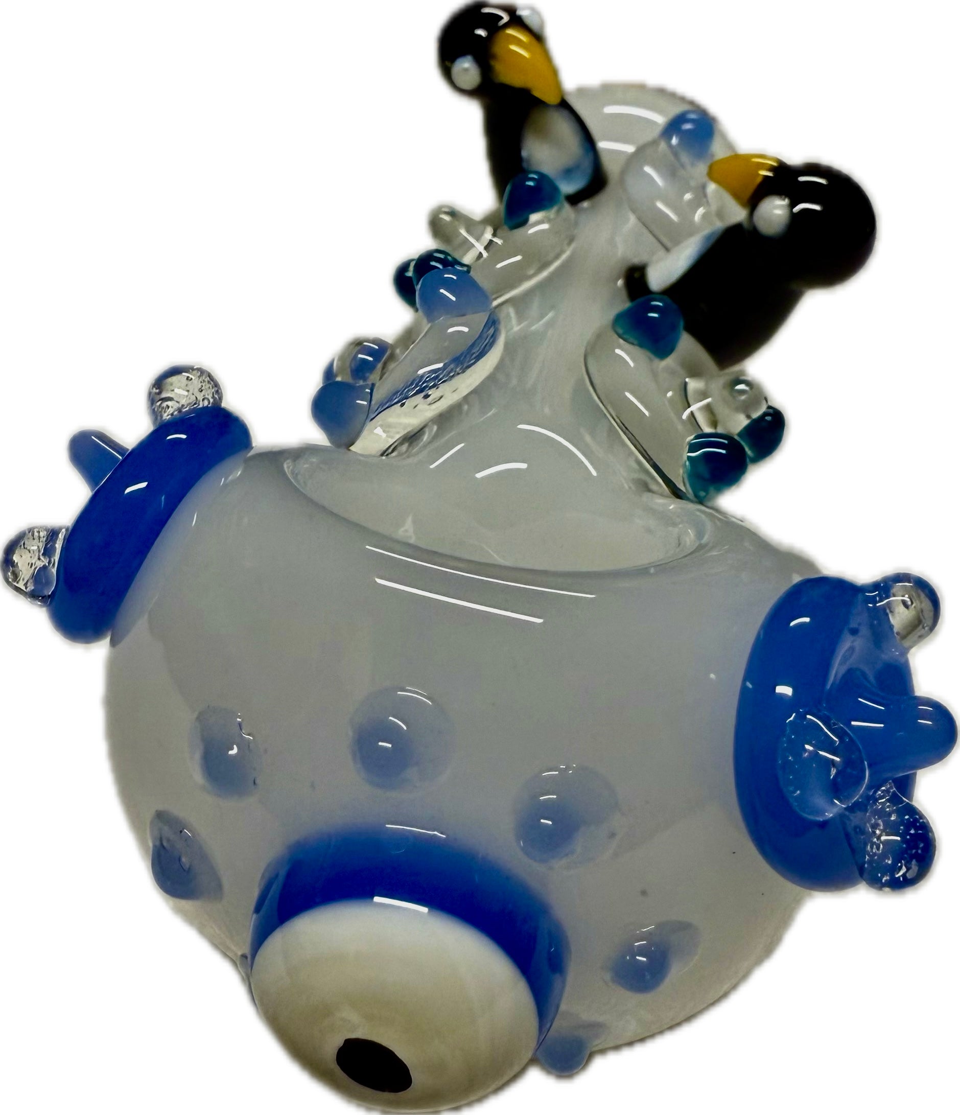 Ripkitty penguin art spoon pipe — frosted clear/white, front-facing bowl view showing blue evil eye accent, teal dots, and blue flipper accents